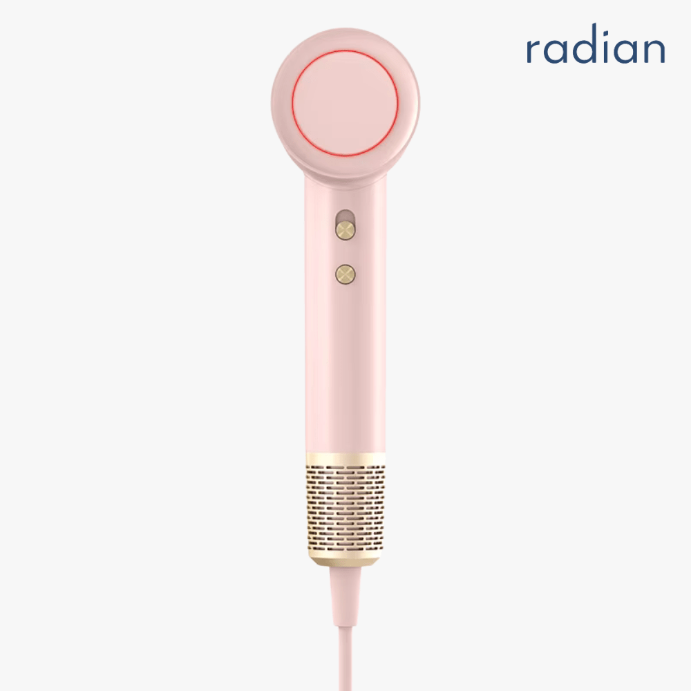 Radian Vortex Lite hair dryer in soft pink with gold accents, front view